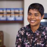 Crime fiction author and Australian Writers' Centre alumna Dinuka McKenzie smiling in floral shirt